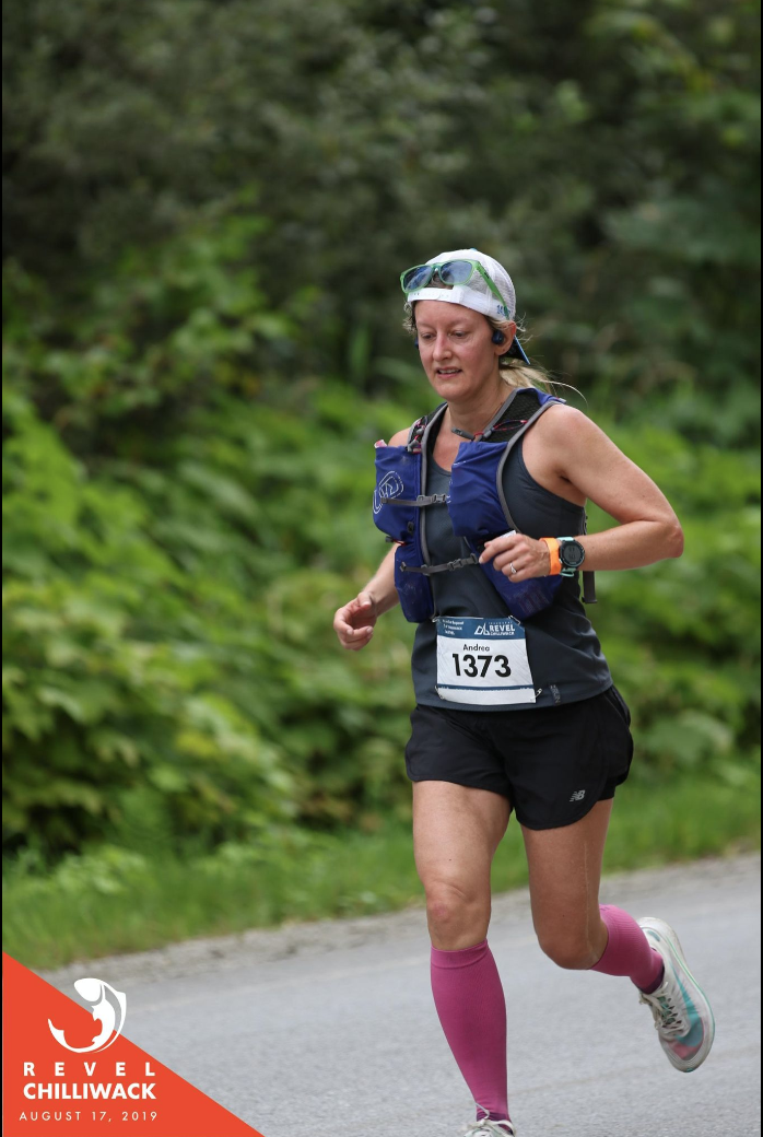 Woman running with a focused look on her face