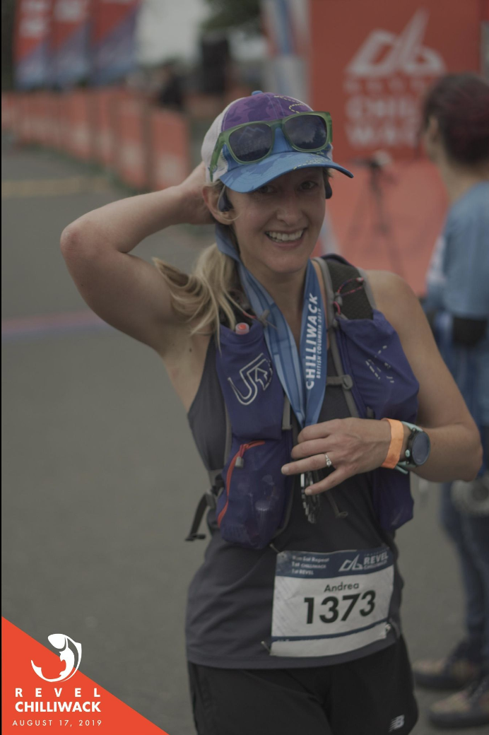 Woman smiling at the end of a marathon