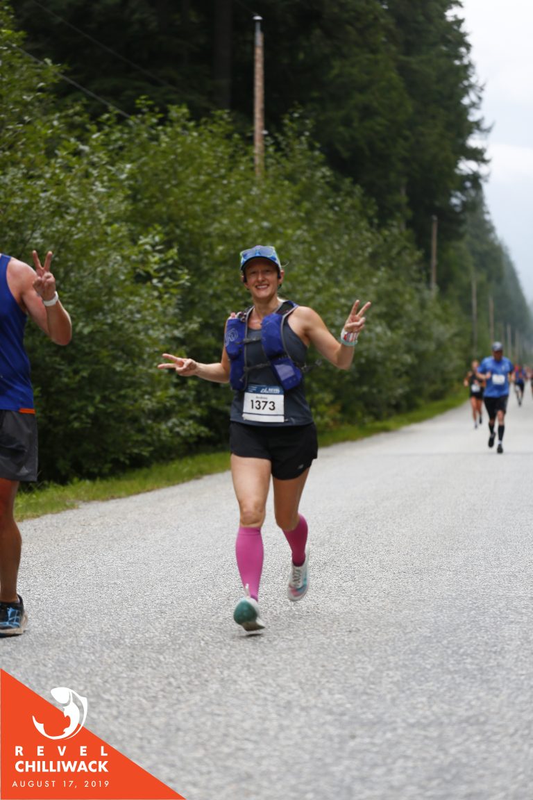 Woman running with a big smile on her face